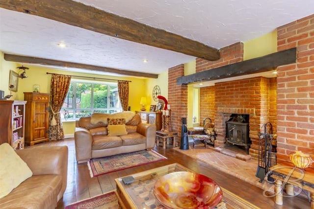 We launch our tour of the Lichfield Lane house in the lounge or living room, which is the hub of the property. Its solid oak floor, added beams feature and inglenook fireplace with log burner give it oodles of character. The room is cosy but also ideal for entertaining family and friends.