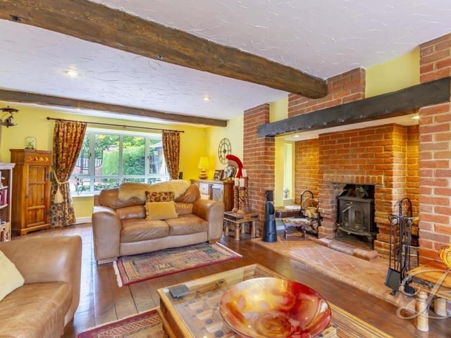 We launch our tour of the Lichfield Lane house in the lounge or living room, which is the hub of the property. Its solid oak floor, added beams feature and inglenook fireplace with log burner give it oodles of character. The room is cosy but also ideal for entertaining family and friends.