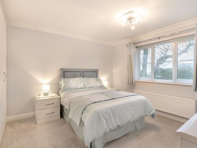 The master is the first of four good-sized bedrooms. A major asset is fitted wardrobes with hanging rails and shelves, while the window overlooks the back garden.