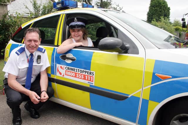 2007: Pictured at a summer fair at Greasley Beauvale Junior School are PCSO Derek Kershaw and Lauren Crossland, 10.