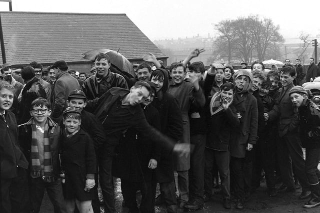 These lads queue with their mates in 1962 to get tickets to the big game.