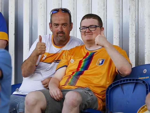 Mansfield fans watch the Carabao Cup first round match against Derby County FC at the One Call Stadium.