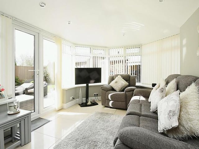 At the back of the £420,000-plus house is this conservatory, which radiates brightness. A tiled roof ensures the space can be used all year round, and doors provide access to the back garden.