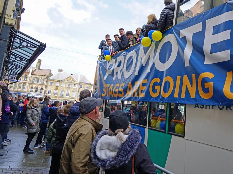 Crowds packed into Mansfield town centre this afternoon to salute their heroes.