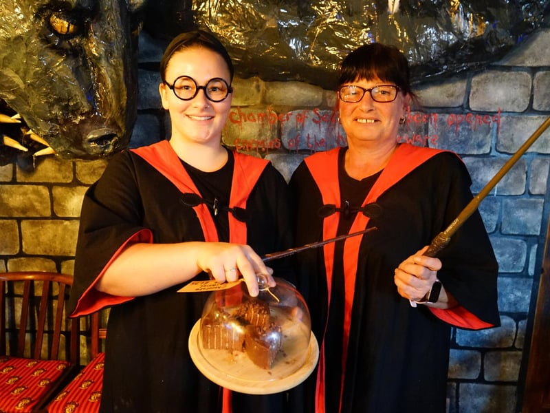Staff get into the spooky spirit with wizard cloaks and wands.