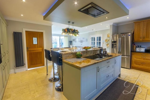 The kitchen really is the perfect place to embrace your culinary skills. The units and cabinets are complemented by a work surface over and a Belfast sink. There are two windows at the front and a pair of sliding doors leading into the garden.