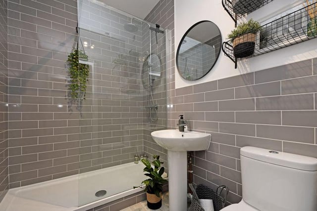 Off the dressing room is a shower room - recently refurbished by the present owner - containing a double shower with a glass screen, a white wash basin, WC and a chrome heated towel rail.
