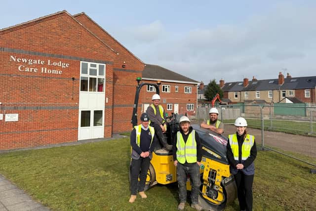 The team of construction workers outside Newgate Lodge