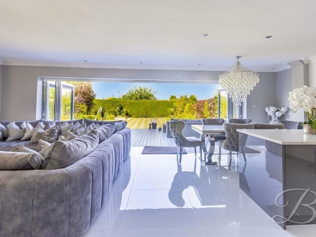 Large bi-folding doors in the open-plan hub present this spectacular sight, with the rear garden at the Derby Road property stretching before you.