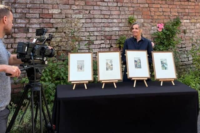 Carloyn Melbourne, from the museum, with the rare paintings by DH Lawrence. Photo: Broxtowe Council Facebook