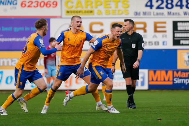 Mansfield Town midfielder Ollie Clarke scores the equaliser. Photo by Chris Holloway/The Bigger Picture.media