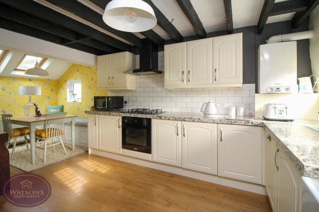The dining kitchen has been newly-fitted as part of the partial refurbishment of the cottage. It includes a range of matching wall and base units, while integrated appliances include an electric oven and five-ring gas hob with extractor over, a washing machine and dishwasher. There is also a wall-mounted boiler.