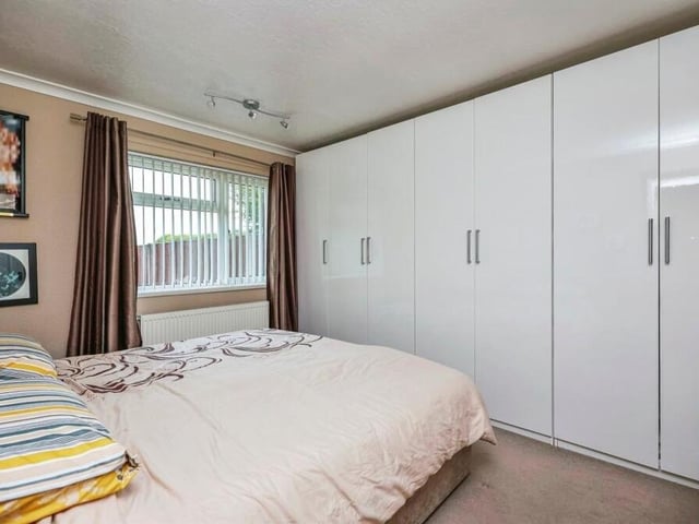 Both of the main double bedrooms include extensive fitted wardrobes, as well as a carpeted floor.