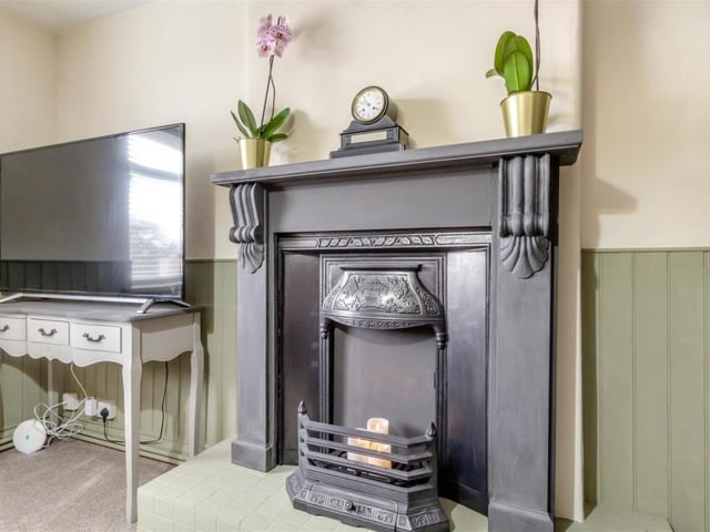 A jewel in the crown of the master bedroom is this Victorian, cast-iron decorative fireplace, with hearth and surround.
