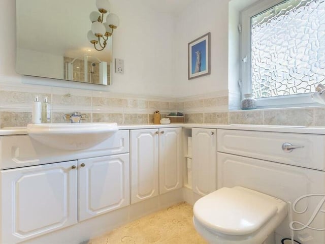 A second view of the squeaky-clean family bathroom.