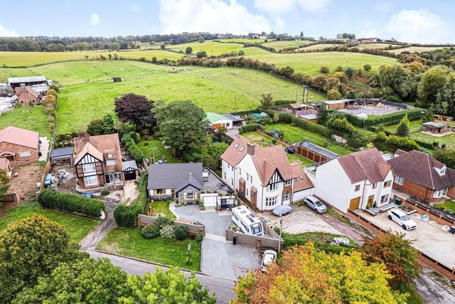 This aerial shot shows how the impressive bungalow fits in to the Sutton landscape -- and how it backs on to attractive, rolling countryside.