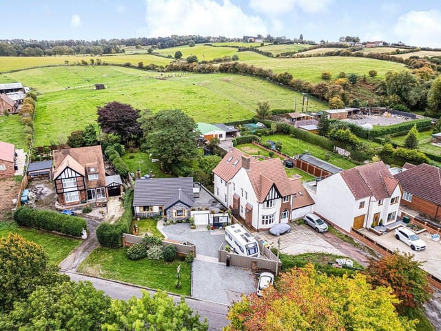 This aerial shot shows how the impressive bungalow fits in to the Sutton landscape -- and how it backs on to attractive, rolling countryside.
