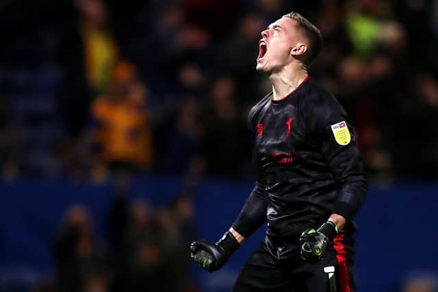 Nathan Bishop of Mansfield Town celebrates after his side score.