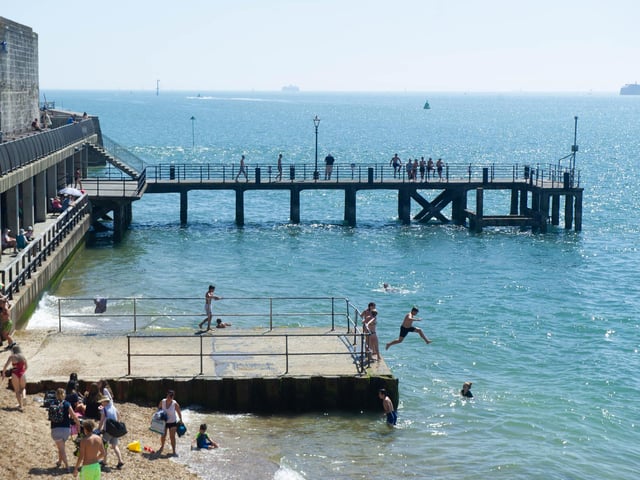 People making the most of the warm weather at the Hotwalls, Old Portsmouth. Picture: Habibur Rahman