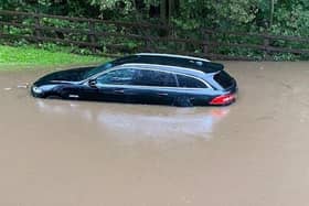 A car submerged by flood water after Storm Babet in October 2023 at Sherwood Forest Caravan Park.