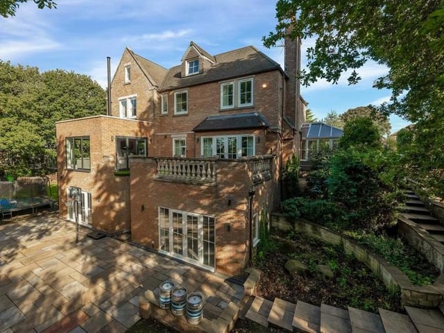 Let's step outside now and, as you can see, the property is as impressive from the rear as from the front. Spot the balconies and also the steps leading down to the lower-level rear garden.