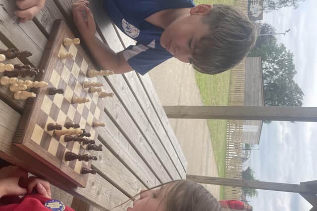 Leamington Primary Academy pupils Will Mead and Grace Hovey enjoy a game of chess, after launching a chess club at the Sutton school. (Photo by: Lou Brimble/By Appointment PR)