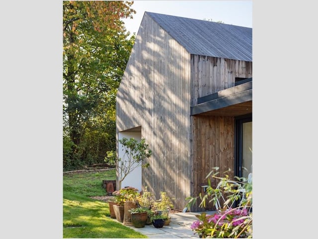An exterior view of the Kebony-clad new family home in Braishfield, Hampshire.