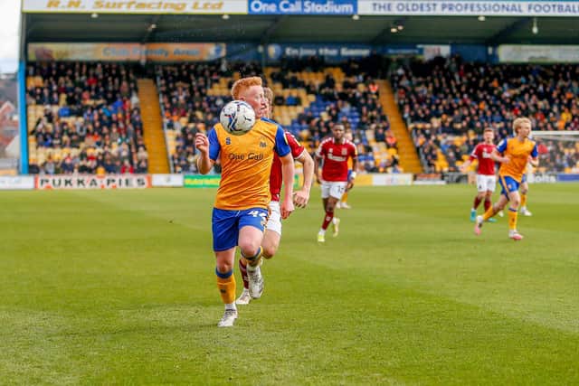 Mansfield Town midfielder Matthew Longstaff looks to make a cross against Northampton Town.