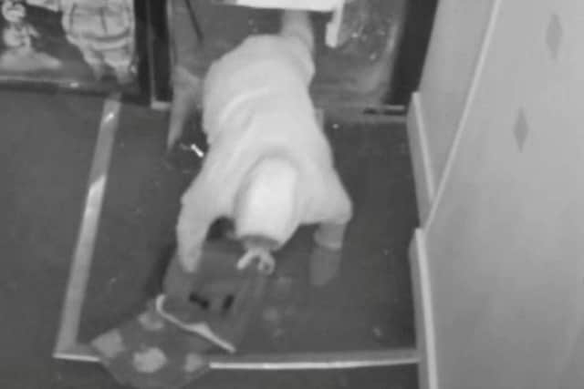 CCTV footage shows two men smash through the front door at Jakes Breaks trading card shop shortly after 6am on Thursday 1st January before emptying the contents of some of the display cases into their backpacks.