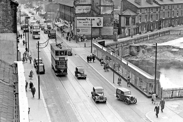 The Moor looking towards junction with Prince Street. Temporary window display belonging to John Atkinson, 1950