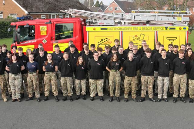 Uniformed protective services students with firefighters from Mansfield’s Blue Watch, pictured at the college’s Derby Road campus.