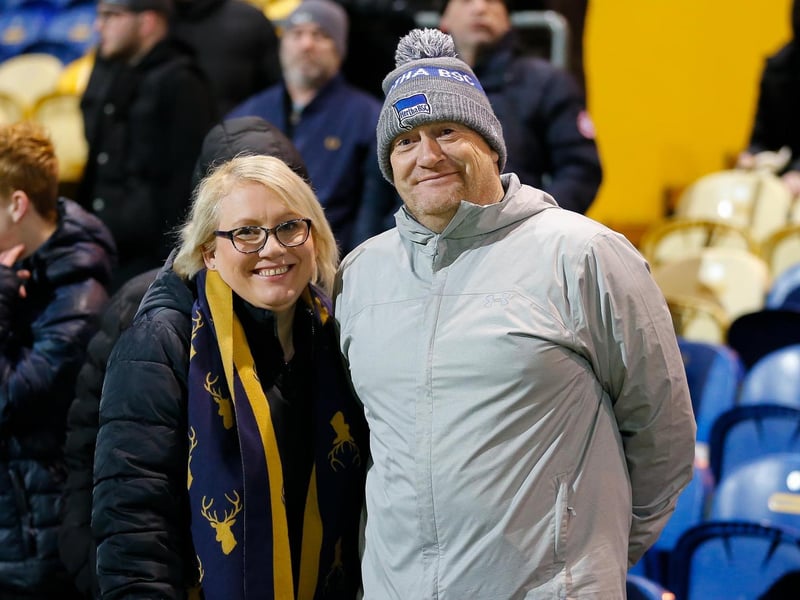 Mansfield Town's faces in the crowd against Swindon Town.