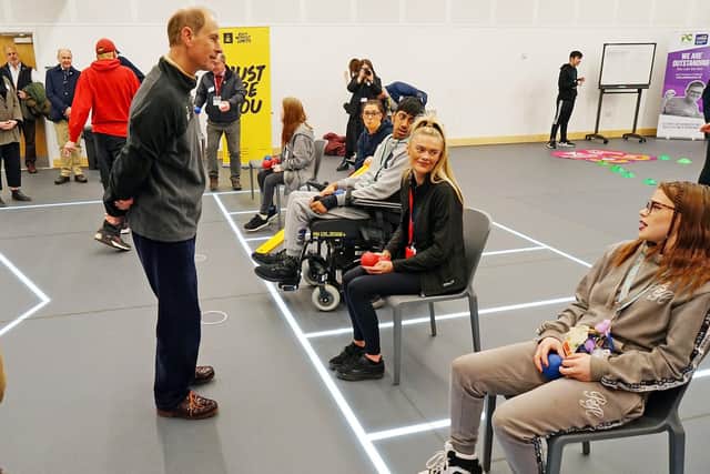 The Duke meeting students in the new sports hall.