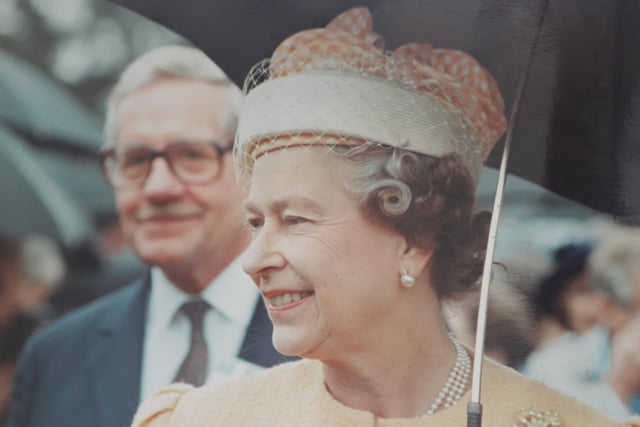 The Queen braves the weather on her visit to Portland College in Harlow Wood back in 1990.