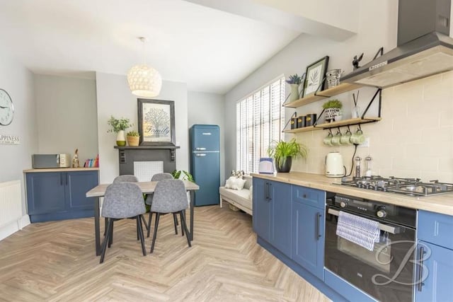 Our photo gallery begins in this tasty kitchen/diner, which comes complete with a range of attractive units and cabinets. There is space for a fridge/freezer and a dining table, while the herringbone-style floor adds a nice touch.