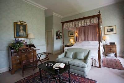 A four-poster bed in one of the plush suites. Image: Middlethorpe Hall