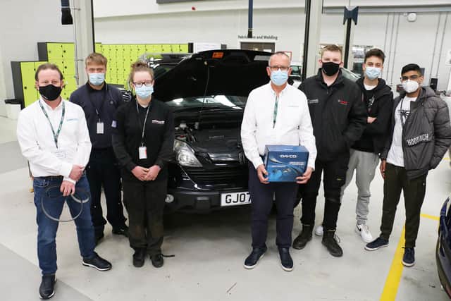 Some of the trainee mechanics with representatives from Dayco