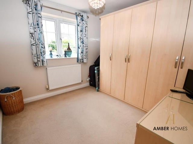 This fourth bedroom has plenty of wardrobe space.