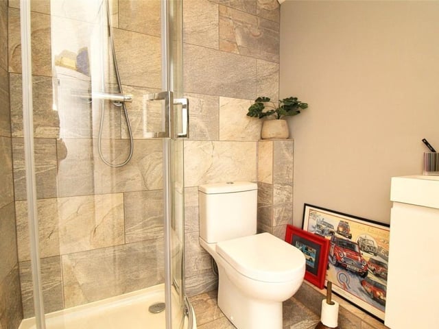 A smart walk-in shower and toilet, which make up  the en suite facilities to the master bedroom.