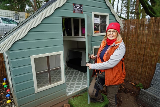 Denise Hardwick with Billy's bungalow. The dogs are given a safe space to adhere to their needs.