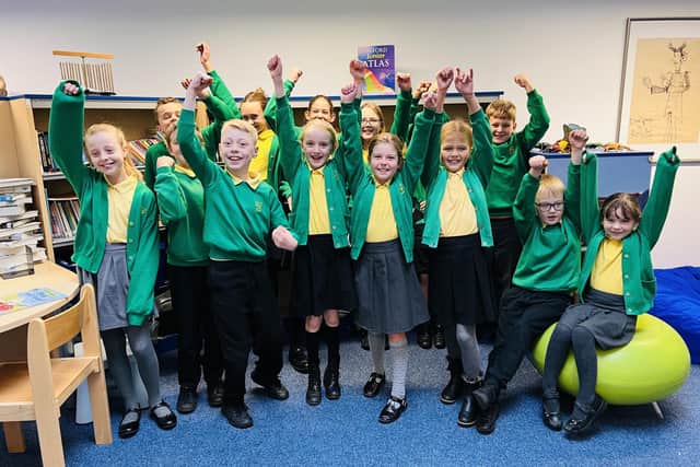 Children at Gilthill Primary School celebrating the latest Ofsted results.