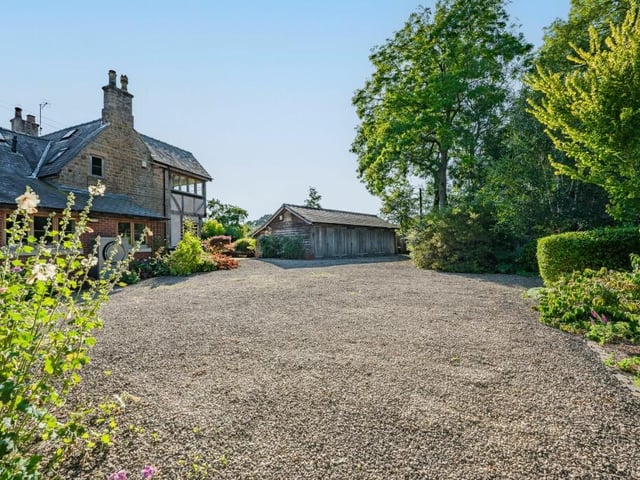 Electric gates at the entrance to the £1.15 million property offer direct access to a driveway and motor court that provide off-street parking space for several vehicles.