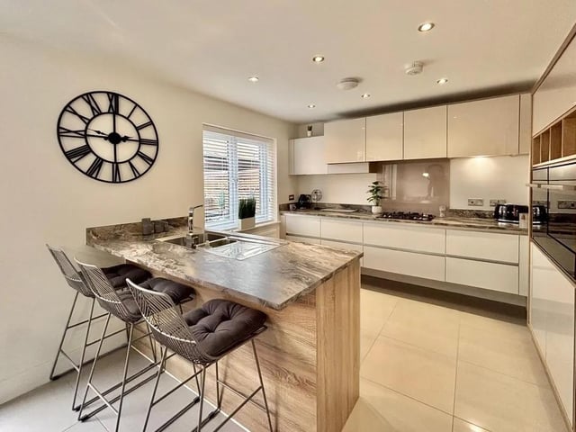 This stunning, four bedroom, detached family home is located on a quiet street in the highly sought after Clipstone Village in Mansfield, Nottinghamshire. Located close to good schools and local amenities, this beautifully modern property would make the perfect family home. The heart of the home is a modern kitchen/diner with central island.