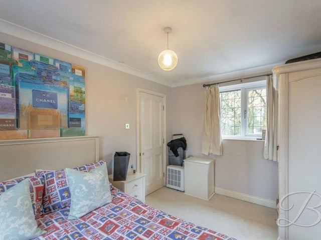 The second bedroom is a cute and comfortable space. It also has storage space and a window that faces the front of the property.