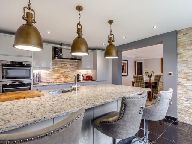 The kitchen features integrated appliances aplenty. All yours are a stainless steel AEG microwave and separate single oven, a Neff induction hob with extractor hood above, a Neff fridge and larder cupboard, a CDA wine cooler and Bosch dishwasher.