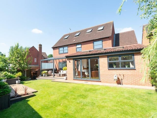 Time to step outside now, and here is a view of the rear of the £425,000 Mansfield Woodhouse property, showing the bi-folding doors that open out from the kitchen's living space.