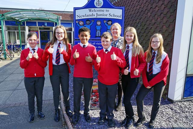Alison Castledine, Newlands Junior School headteacher, celebrates the school's good Ofsted report with pupils.