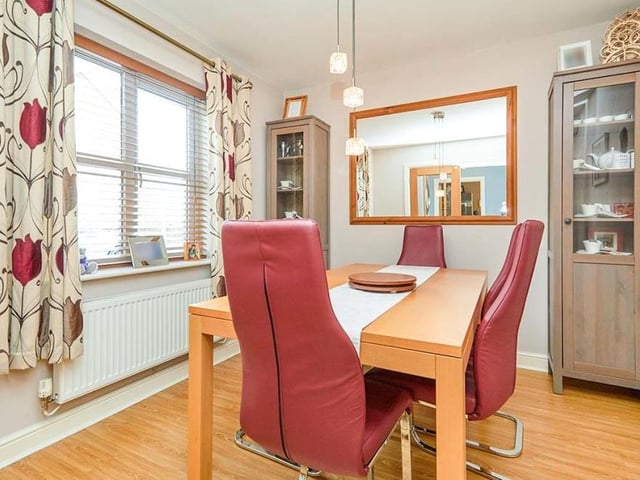The dining room, which is a good size, is a pleasant space for evening meals or to entertain friends. The uPVC double-glazed window overlooks the front of the house, while double doors lead into the hallway. The floor is laminated.