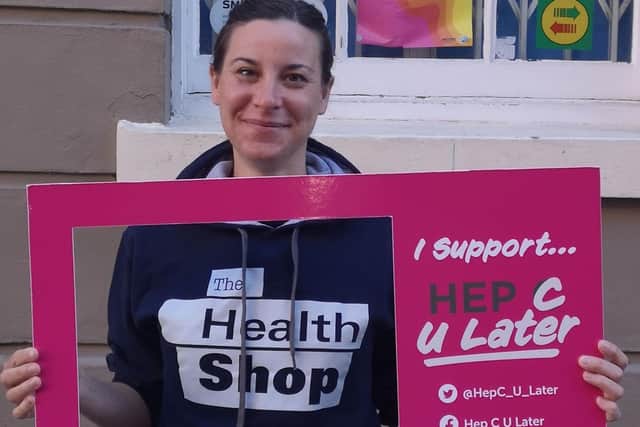 Photo with Health Shop colleague and Hep C U Later board.