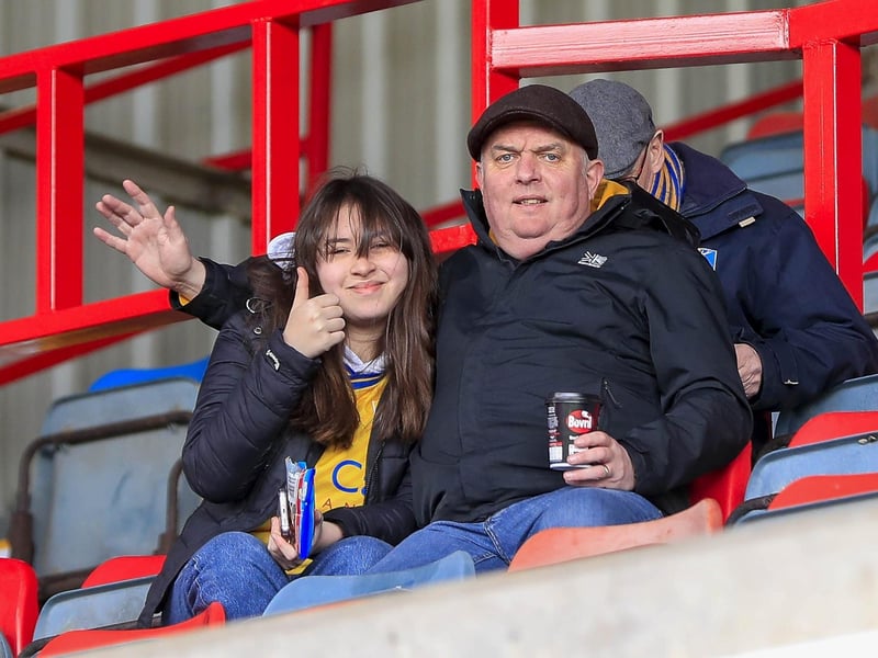 Mansfield Town fans watch the defeat at Wrexham.